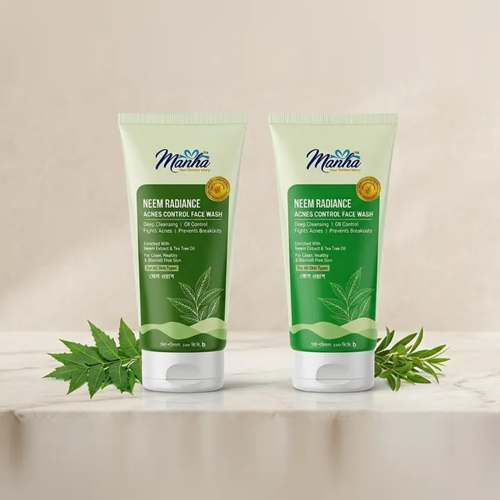Two tubes of Manha Neem Radiance Acne Control Face Wash with neem leaves